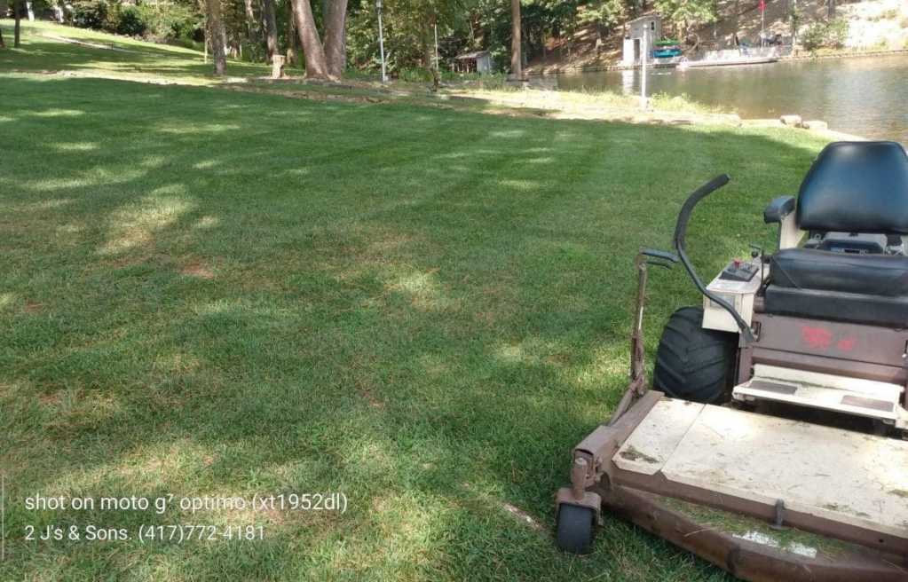 Grasshopper Zero-Turn Mower Providing Precision Lawn Care Service in NWA