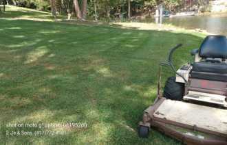 Grasshopper zero-turn mower providing lawn care in Northwest Arkansas and Southwest Missouri