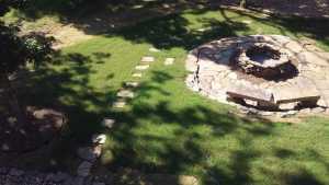 new sod with stepping stones and custom fire pit